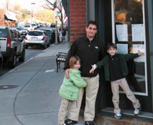 City Councillor-elect Frank Baker and his two five-year old children, Maxine and Benjamin, on Monday afternoon outside of his campaign office on Savin Hill Ave.